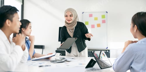 Preview: Confident muslim woman in hijab making presentation, using digital tablet