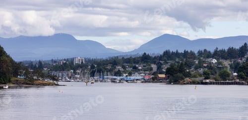 Preview: City by the water, Marina with Boats, surrounded by Homes, mountains and trees. Summer Season.