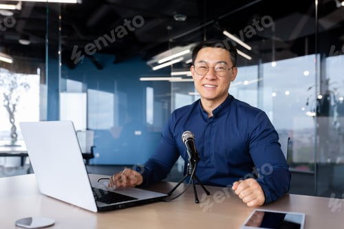 Preview: Portrait of successful asian businessman inside office, business coach teacher recording audio