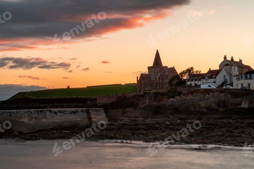 Preview: Scenic sunset over coastal town and waterway