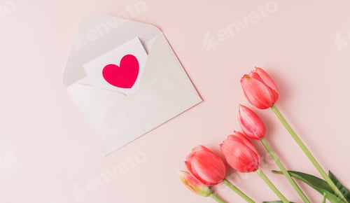 Preview: Red tulips and a card with a heart on a pink background