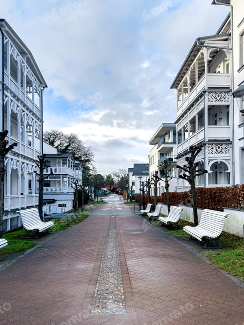 Preview: Street between beautiful white houses, residential area.