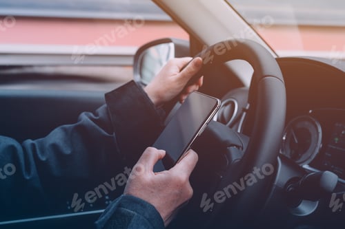 Preview: Using mobile smart phone while driving the car down the highway road