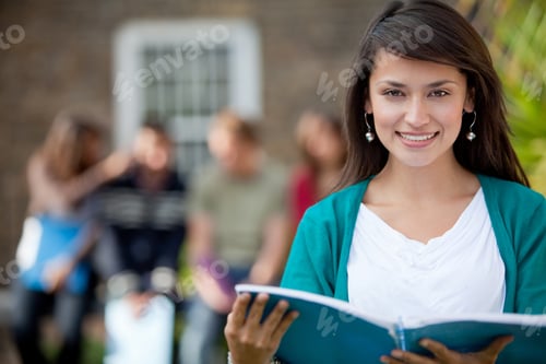 Preview: Female Student Outdoors With A Group Of People At The Background