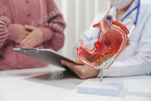 Preview: female medical professional a stethoscope is holding a clipboard, possibly discussing gastritis