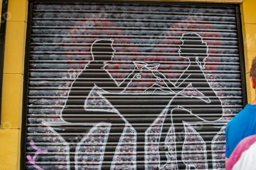 Preview: A painted garage door with two young people having martinis over a martini shaped table and chairs