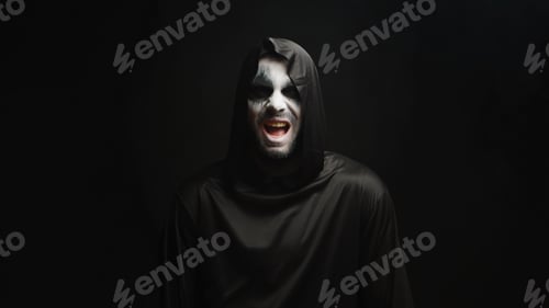 Preview: Grim reaper with scary laughing over black background