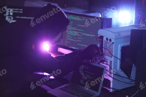 Preview: Computer Hacker in Dark