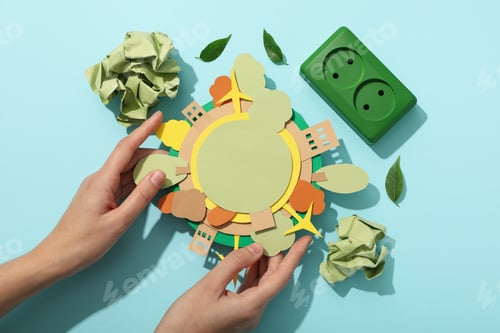 Preview: Paper model of the Earth with green electric sockets