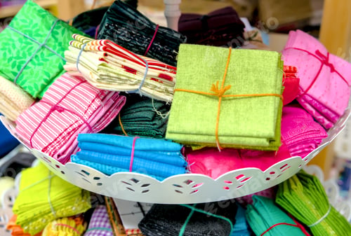 Preview: colorful textile fabrics for sale in a shop