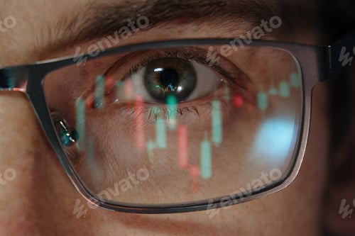 Preview: close-up of a trader eye with financial graphs reflecting in his eyeglasses