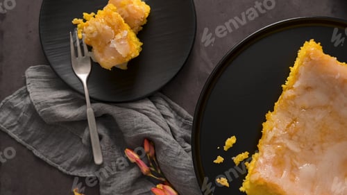 Preview: Lemon cake slice on black plate with fork