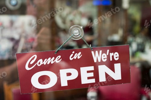 Preview: View through window of open sign in shop