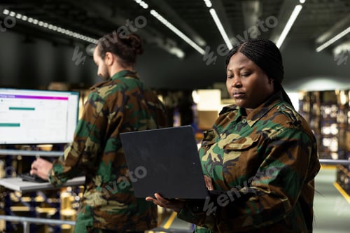 Preview: Military staff coordinating warehouse logistics and reviewing tracking info