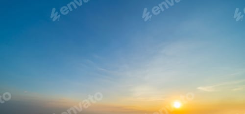 Preview: Sunset sky. Abstract nature background. Dramatic blue and orange, colorful clouds at twilight time.