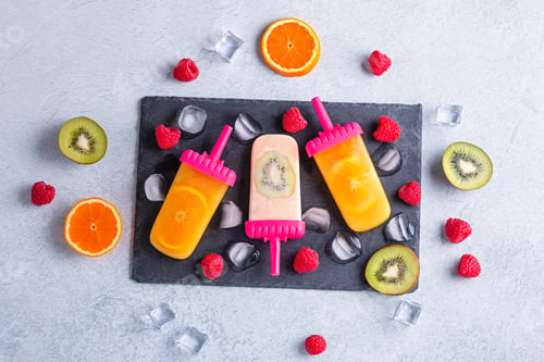 Preview: Colorful summer popsicles with fruits, top view
