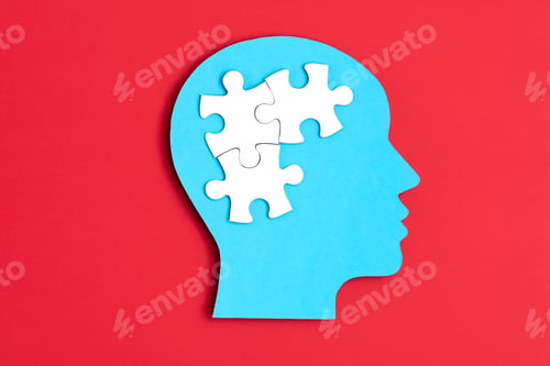 Preview: Papercut head with jigsaw puzzle pieces inside. Mental health problems, psychology, memory, logic