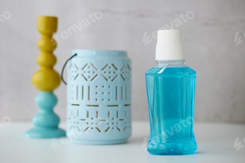 Preview: mouthwash liquid in a container on table