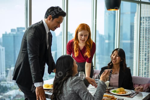 Preview: Group of diversity people are celebrating at luxury restaurant.