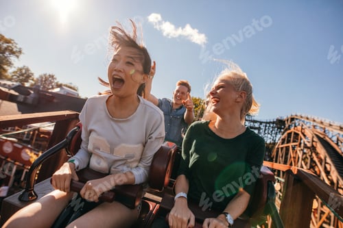 Preview: Young friends on thrilling roller coaster ride