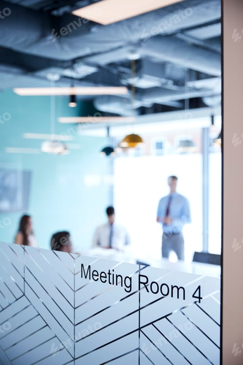 Preview: Boardroom Presentation Viewed Through Meeting Room Window