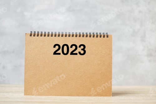 Preview: 2023 Happy New Year calendar on table.