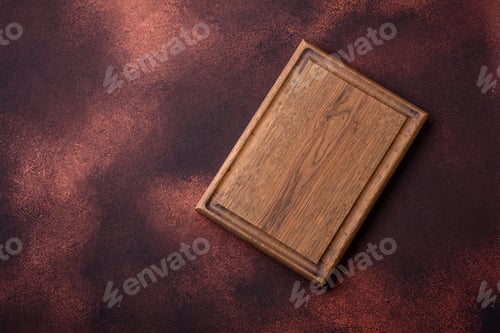 Aperçu: Planche à découper rectangulaire en bois vide sur fond de béton texturé