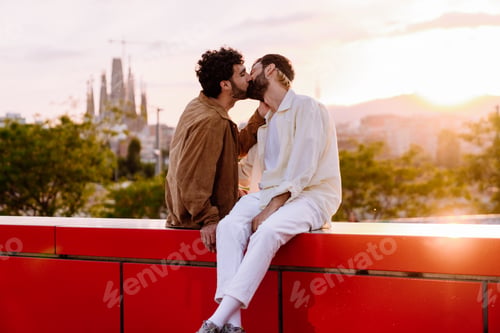 Preview: Loving couple kissing while sitting on bench in street
