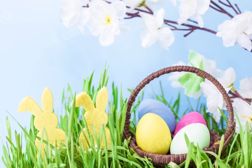 Preview: Easter card. Colored pastel colored eggs in a basket, next to the silhouette of an Easter rabbit,