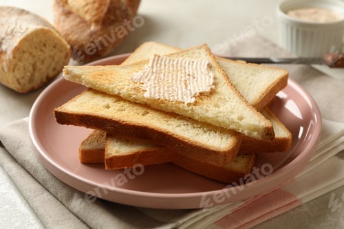 Preview: Concept of cooking toasts with butter, close up
