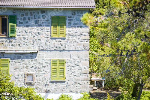 Preview: View of one old building against a majestic mountain landscape and italian vineyards in Cinque Terre