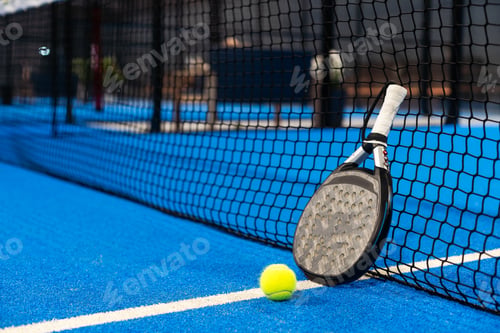 Preview: White professional paddle tennis racket with natural lighting on blue background. Horizontal sport