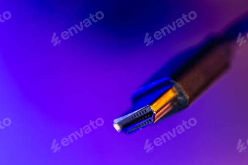 Preview: Macro hdmi connector in neon gradient. Video cable closeup.