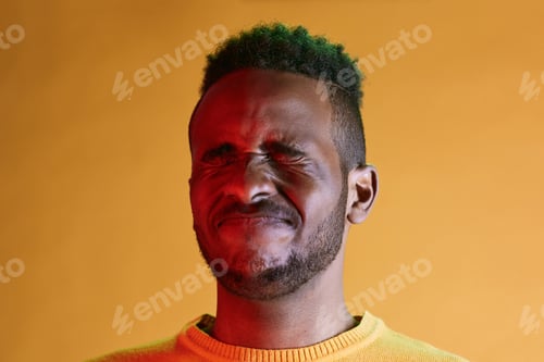 Preview: Art Portrait of Young Black Man with Squinted Eyes
