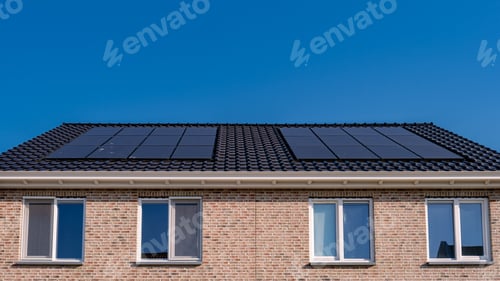 Preview: Newly build houses with solar panels attached on the roof against a sunny sky