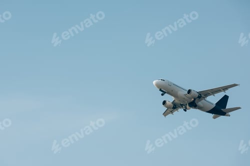 Preview: Commercial jet plane landing in blue sky