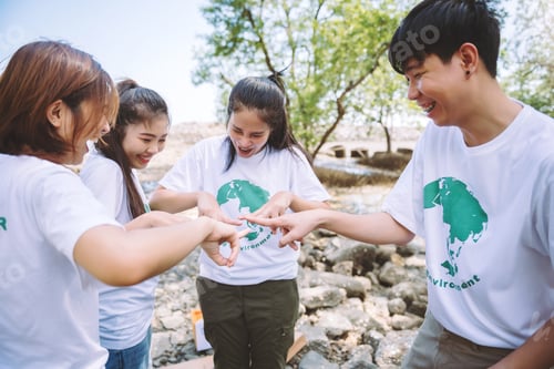Preview: Close up of people volunteer teamwork putting finger on star shape,hands together,Stack of hands.