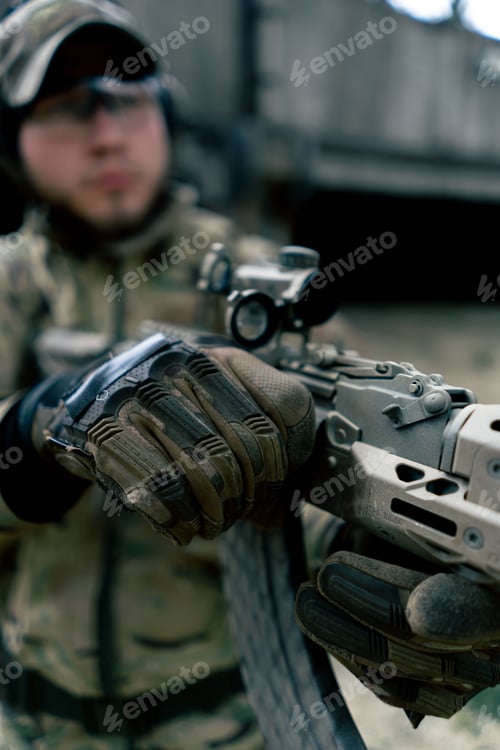 Preview: close-up military tactical strategy NATO rifle position for reloading weapons training at