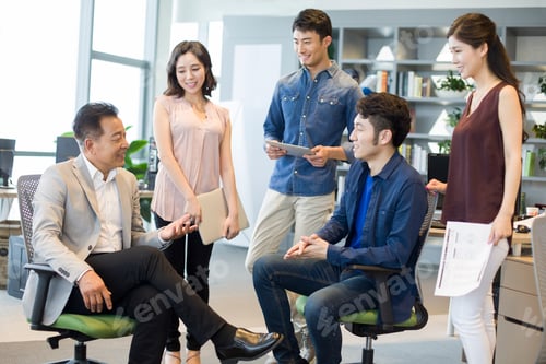 Preview: Business people talking in meeting