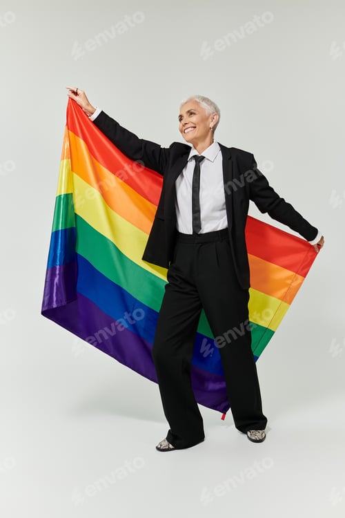 Preview: Celebrating Love and Identity in Stylish Attire With a Rainbow Flag