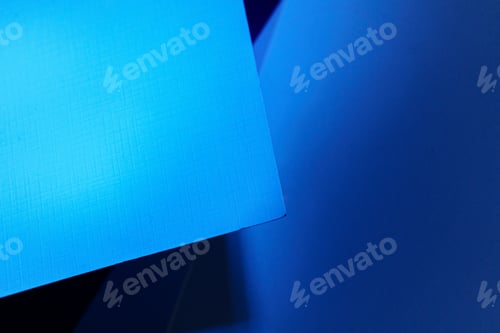Preview: Blank carton paper sheets background in dark blue light