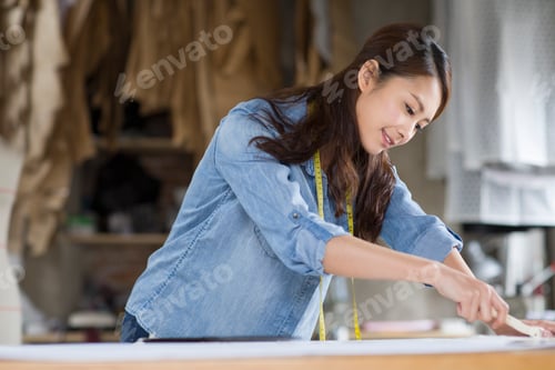 Preview: Fashion designer working in studio
