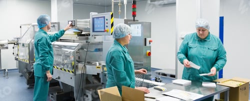 Preview: Pharmaceutical factory workers in sterile environment