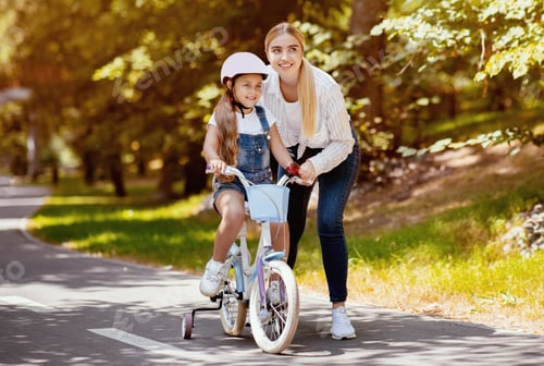 Preview: Mom Teaching Daughter To Ride Bicycle Spending Day In Park