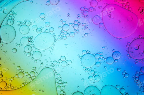 Preview: Chaotic water drops spilled on colorful surface