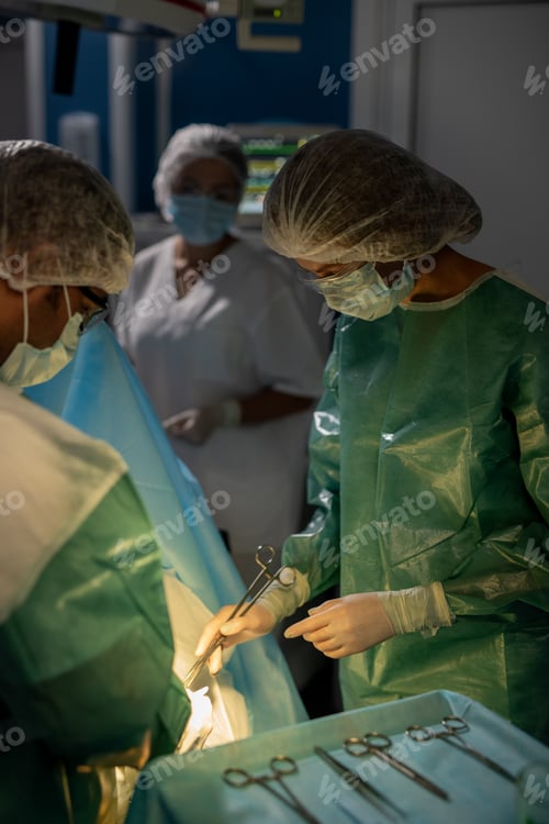Preview: Surgeons Performing Operation in Hospital Operating Room