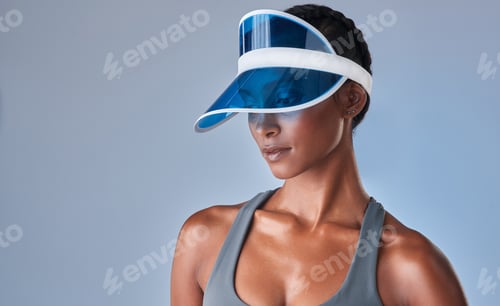 Preview: Studio shot of a fit young woman posing against a grey background