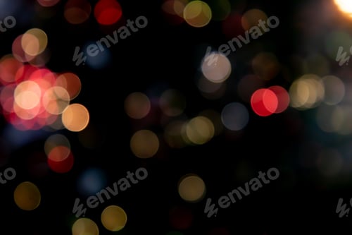 Preview: Dark background with a vibrant display of multicolored bokeh lights.