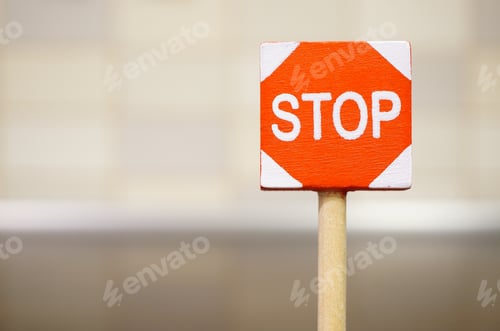 Preview: Closeup shot of a red stop sign on a blurred background