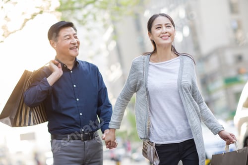 Preview: Happy mature Chinese couple shopping
